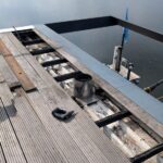 Projekt von SWH Schmigalla zur Kaminsanierung auf einem Hausboot in Potsdam mit Blick auf das Wasser.